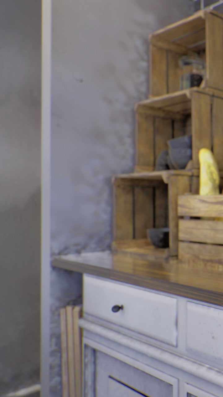 Wooden crates filled with items arranged on a surface in a bright room