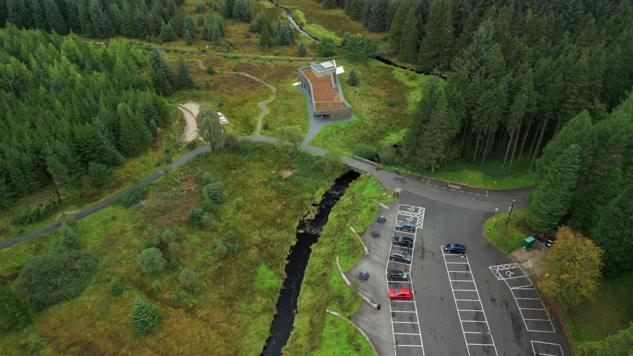 Reversing and ascending 4K 60FPS aerial video of OM Dark Sky Park and Observatory in Davagh Forest, Omagh in Northern Ireland. Produced with broadcast ready Rec709 color