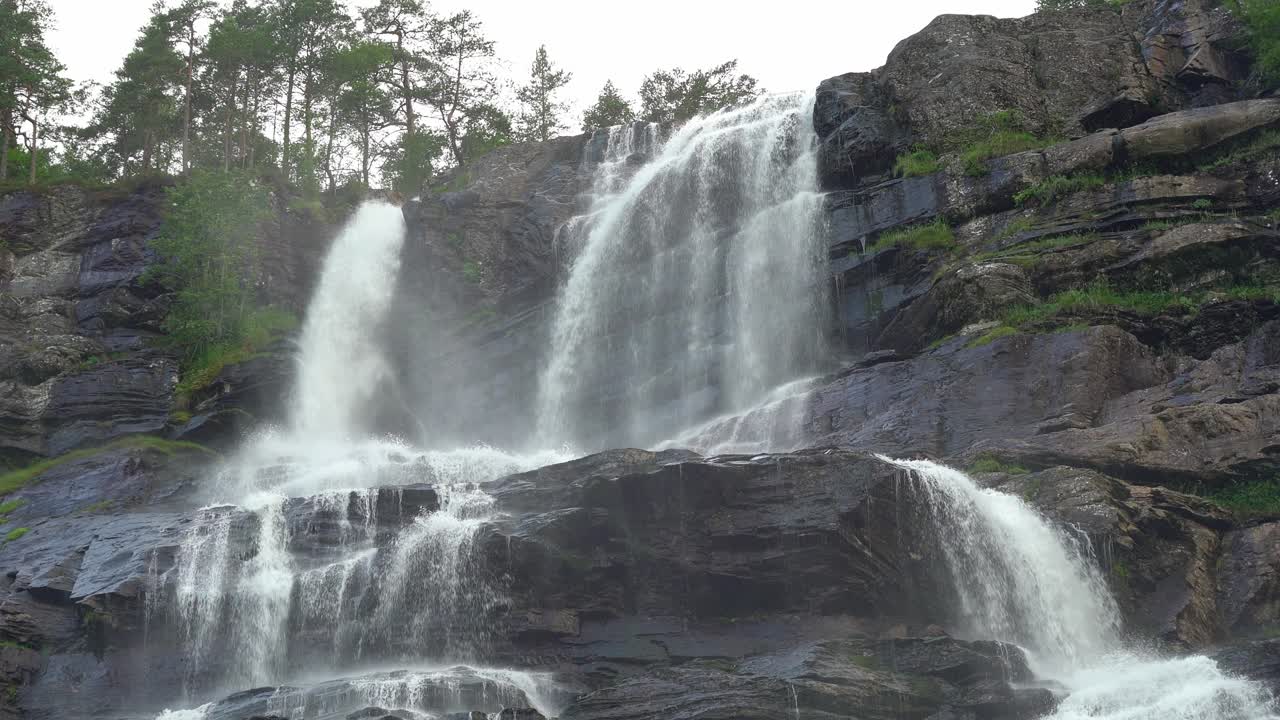 Stunning Tvindefossen waterfall in Voss Norway - Isolated closeup of top section of waterfall splashing down in slow motion