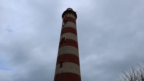 Downward-view-capturing-the-impressive-height-of-Faro-da-Barra-in-Costa-Nova,-Portugal