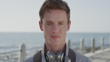 portrait attractive young man student looking serious confident male red head teenager relaxing on warm seaside slow motion