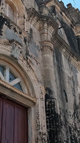 vertical view of old colonial catholic church in central america. church of mercy, granada, nicaragua