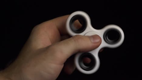 hand holding a fidget spinner