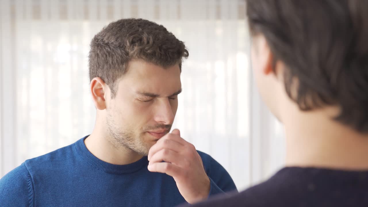 Premium stock video - Bad breath. the man is bothered by bad breath.
