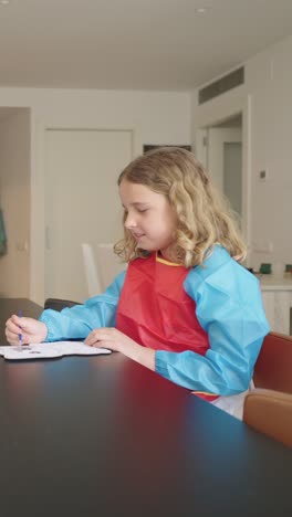 child drawing at table