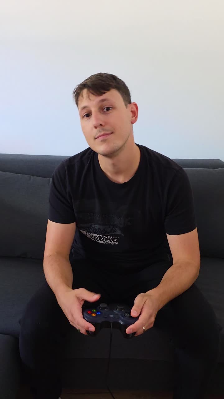 Casual gaming a man discovering video games for the first time, vertical shot