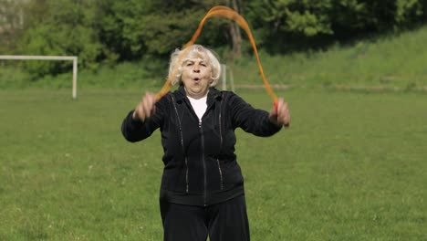 Active-senior-elderly-80-years-old-caucasian-woman-do-morning-physical-exercises