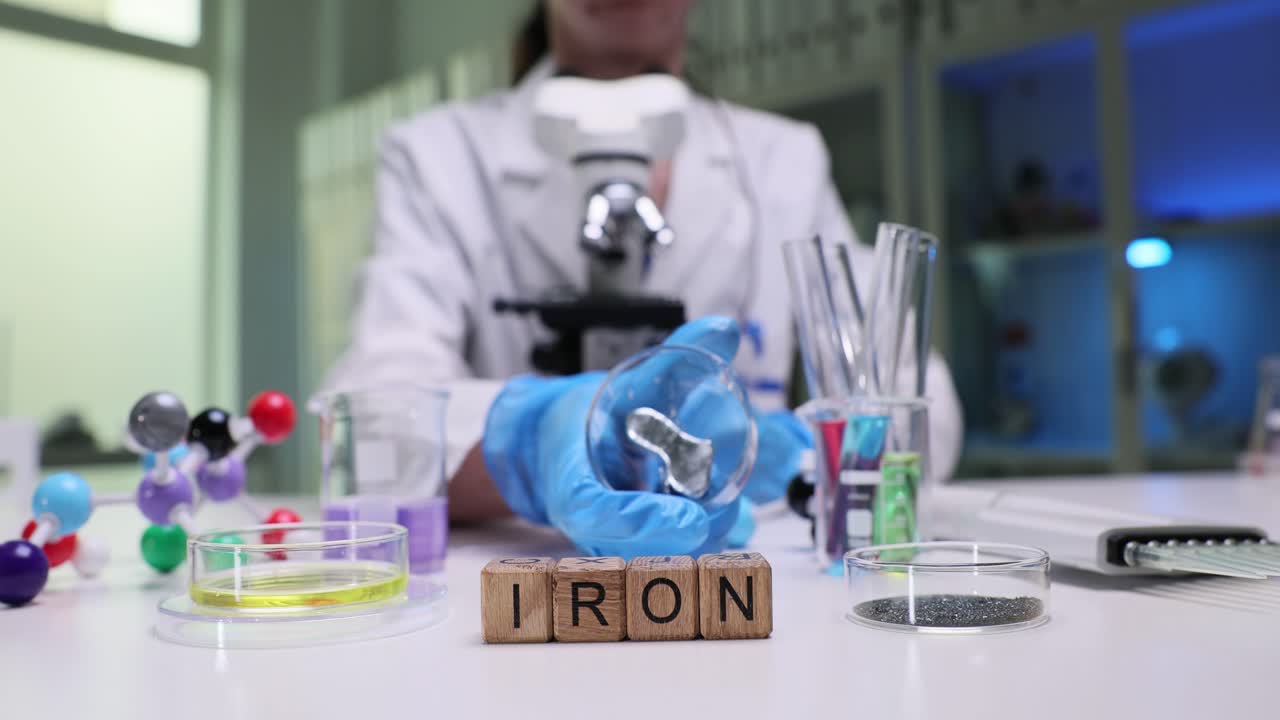 Scientist working with iron in a laboratory experiment