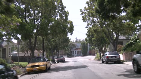 a car travels along a street in santa monica california as seen through the rear window 1