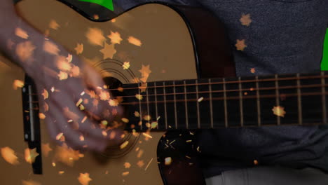 flat design acoustic guitar being strummed in close-up scene, with golden star bokeh