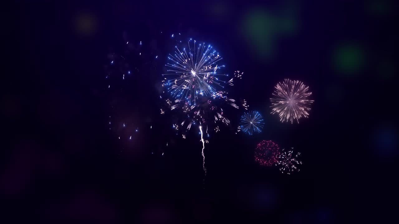 Shining fireworks display explosion with bokeh lights in night sky birthday anniversary celebration