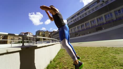 man performing parkour style workout outdoors