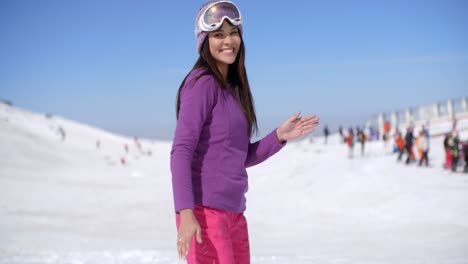 happy young woman at a ski resort