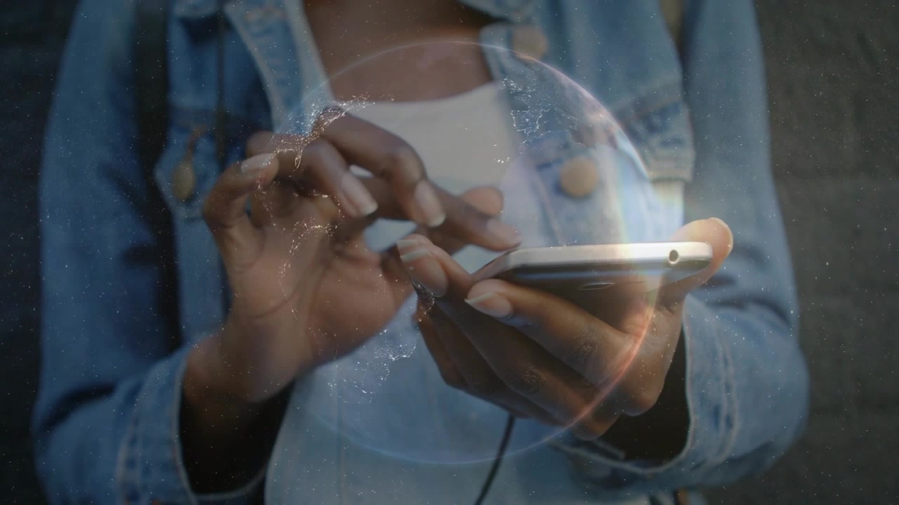 Woman tapping and swiping phone screen, globe overlay shifting and linking phone to tech network