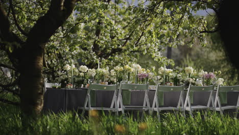 feast-lunch-in-beautiful-garden-table-with-flower-decorations-in-nature