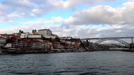 Dom-Luis-I-Bridge-seen-from-Rabelo-Boat-that-navigates-Douro-River-in-Porto