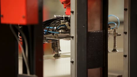 Close-up-of-an-industrial-machine-part-with-hydraulic-mechanism,-selective-focus