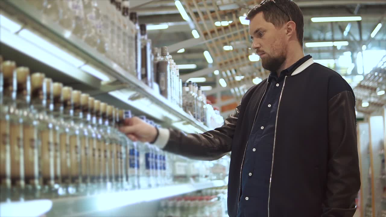 Man Shopping for Alcohol in a Grocery Store
