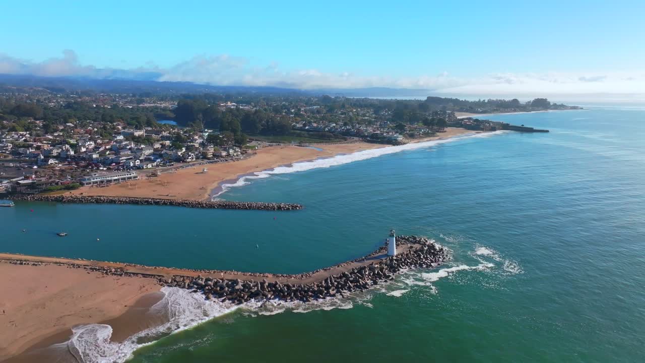 Aerial View of Coastal Town with Lighthouse and Beach