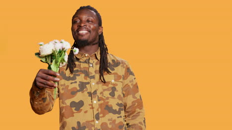 romantic man offering lovely bouquet of flowers to his partner