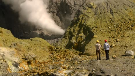 steam rises from volcanic vents in a crater on the small new zealand island of whaakari