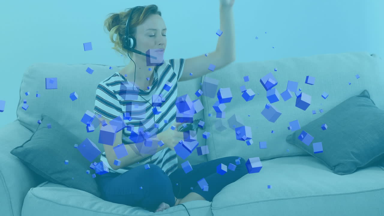 헤드 ⁇ 을 착용 한 백인 여성 이 파란색 상자 들 이 떠다니는 비디오 게임 을 하는 애니메이션