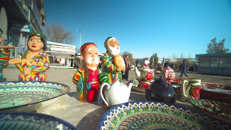 sale of colorful clay figures, national dolls at the chorsu bazaar in the old town of tashkent uzbekistan central asia.