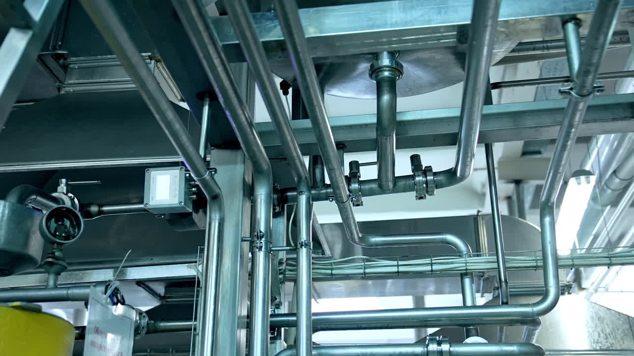 Production of yogurt and milk at dairy factory, industrial equipment for fermentation