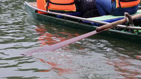 crew team in sync rowing a boat