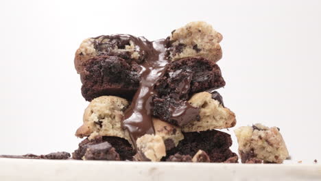 Pouring-Chocolate-Glaze-on-Homemade-Chocolate-Chip-Cookies,-White-Background