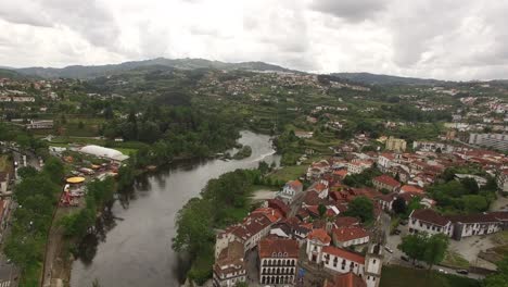 flying over city of amarante along tamega river in portugal