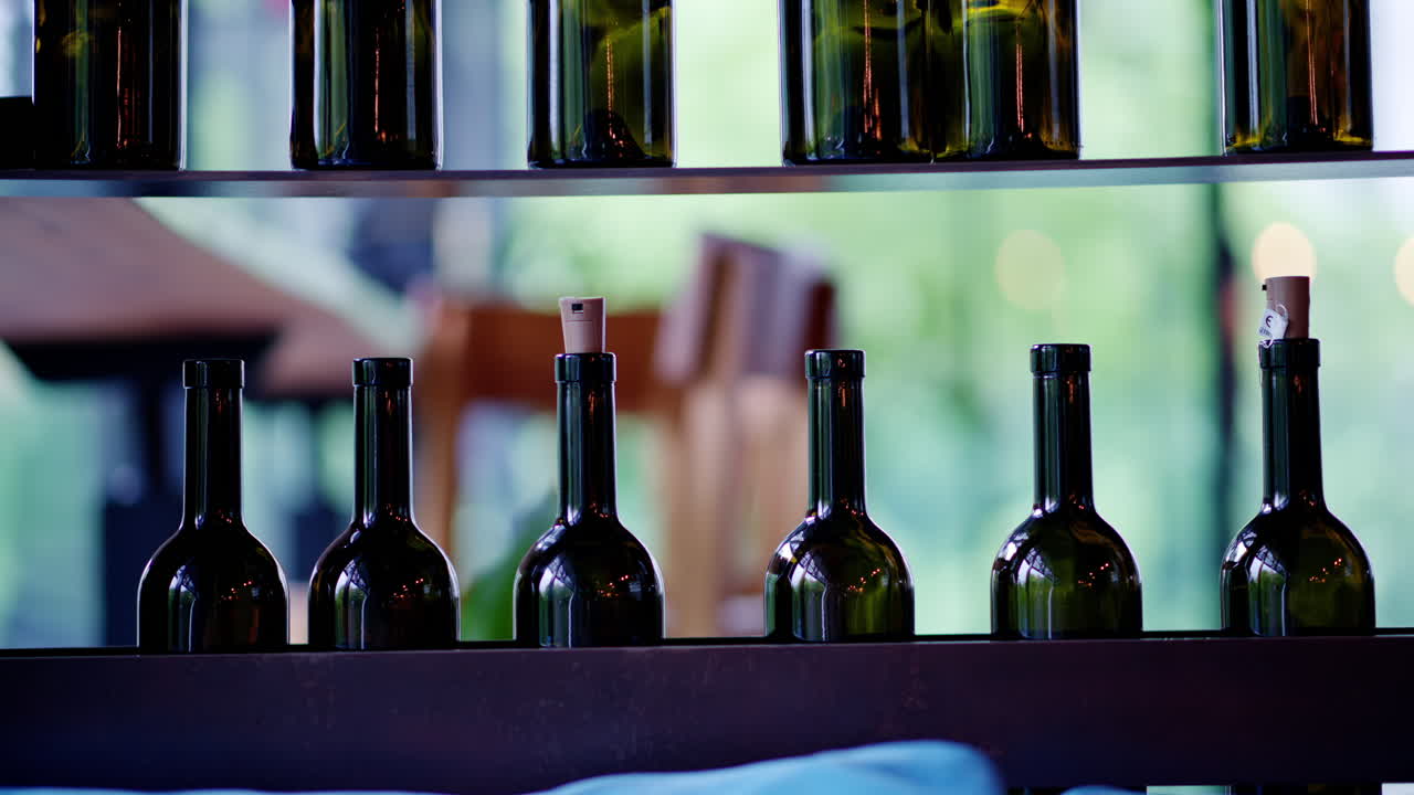 Wine bottles on shelves at a restaurant