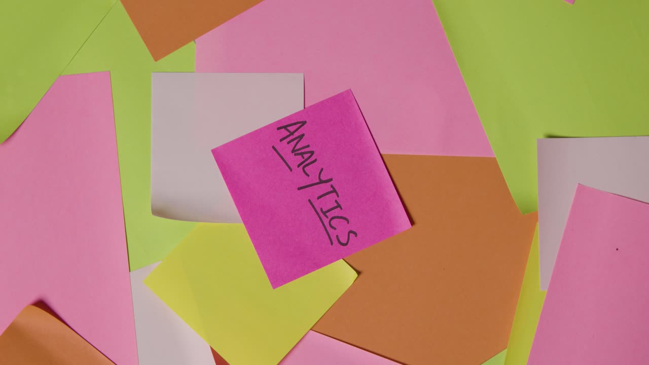 Business Concept Of Revolving Sticky Notes With Analytics Written On Top Note