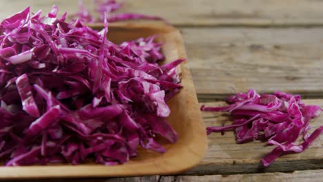 shredded cabbage in wooden bowl 4k