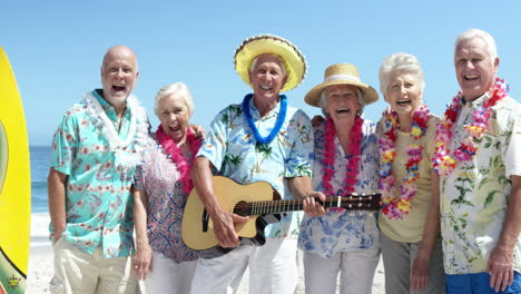 senior friends playing guitar