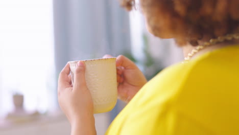 hands, coffee and relax with a woman in her home