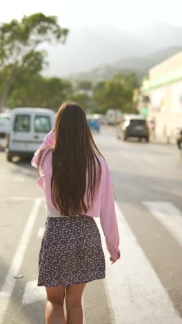 woman walking on a crosswalk