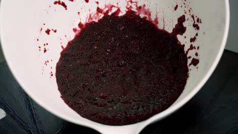 Nice-display-shot-of-red-velvet-batter-inside-white-bowl-making-beet-muffin