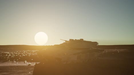 old rusty tank in the desert at sunset