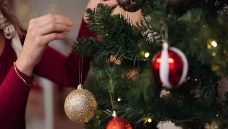 woman decorating christmas tree