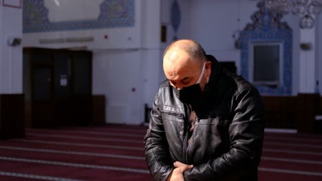 Old-Man-Worships-In-A-Masked-IN-Mosque