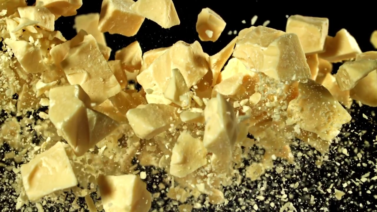 Super Slow Motion of White Chocolate Chunks Exploding and Scattering