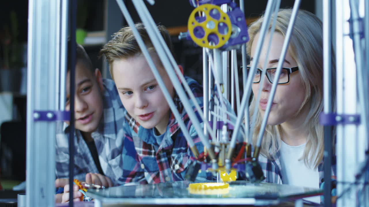 Children and Teacher learning 3D Printing