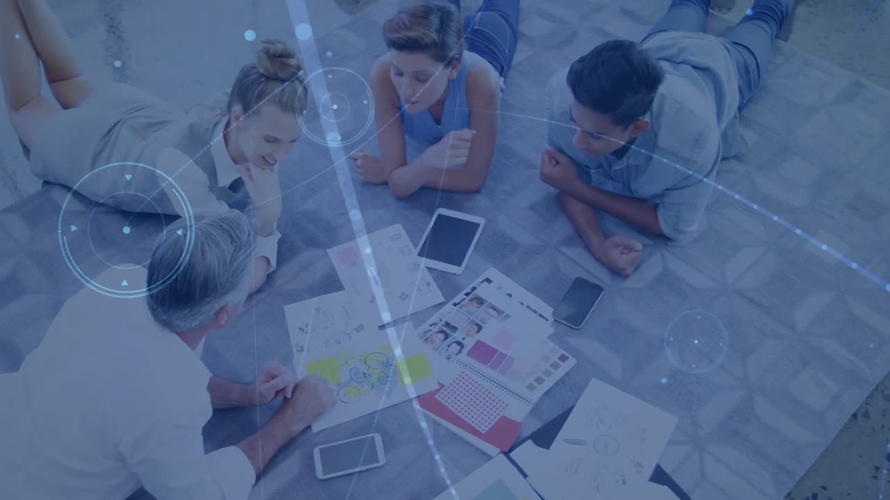 Animation of network of connections over diverse colleagues talking on floor in office