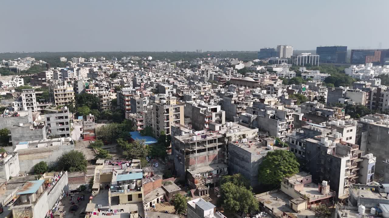 Drone shot showing curved expressway paths bordered by greenery and modern offices