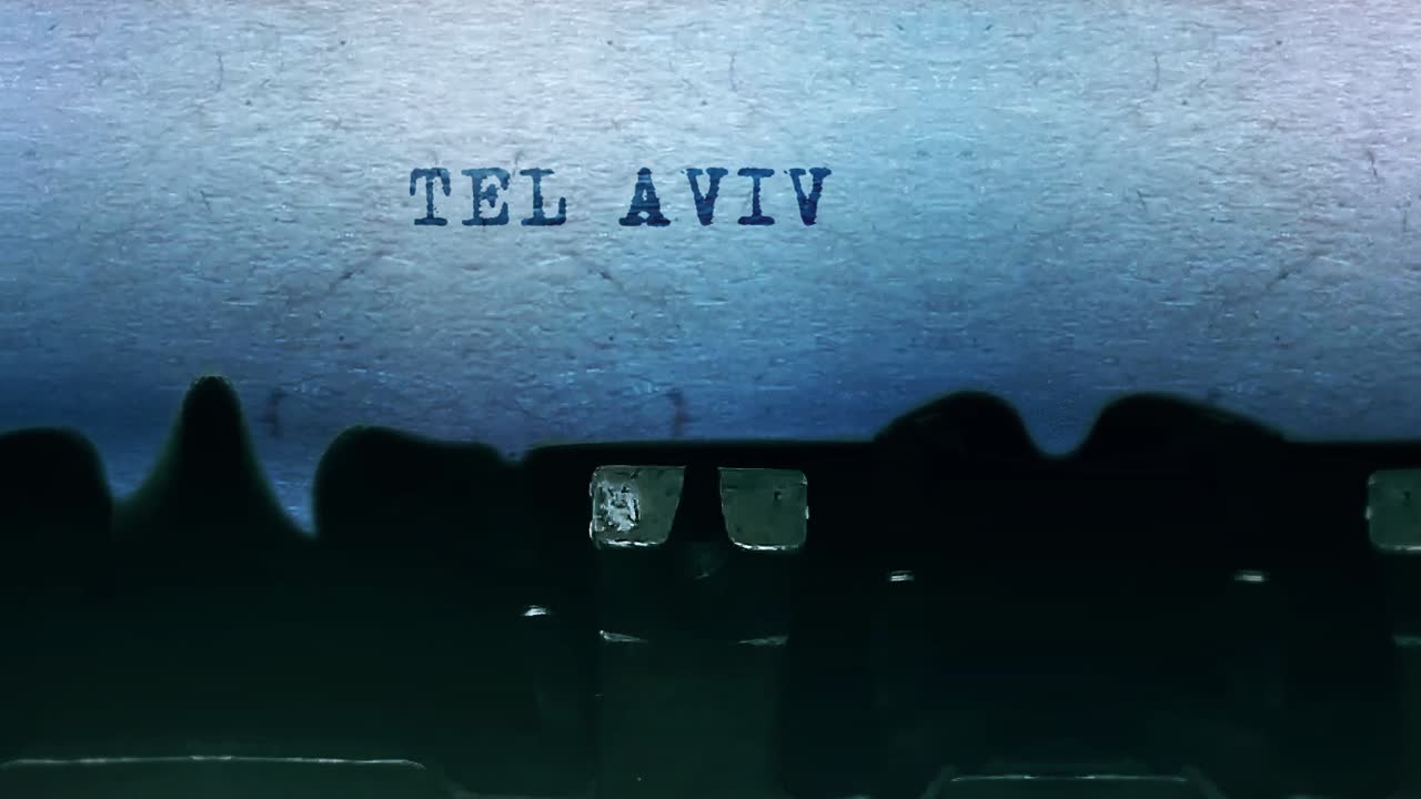 Tel aviv words word closeup being typing and centered on a sheet of paper on old vintage typewriter