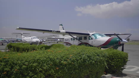 small taxi airplanes parked at arusha airport, tanzania.