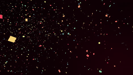 multicoloured pieces of confetti falling seamlessly on a black background