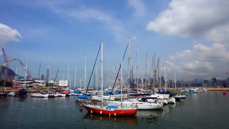 boats floating on calm waters of sea at victoria harbour in hong kong, timelapse