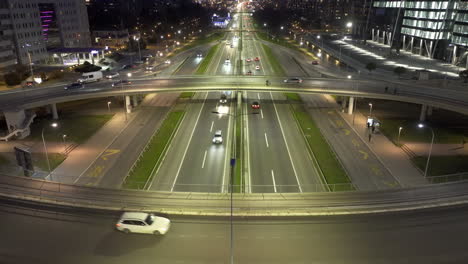 night traffic on a multi-lane highway in an urban setting